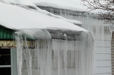 Ice dam on a poorly-insulated and ventilated bungalow roof.